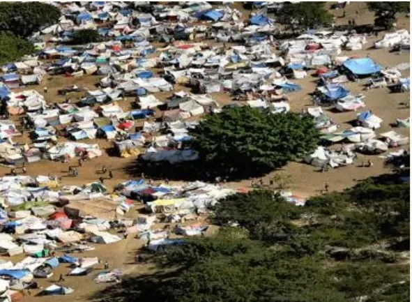 A sprawling refugee camp of improvised tents spreading among sparse trees