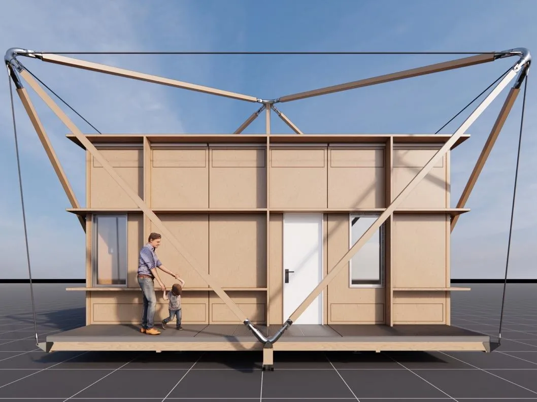 An assembled Estia Home seen head-on, a parent and child on the covered front deck, with panelled walls and a solid door under a clear sky